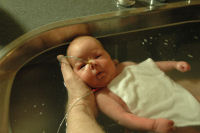Caroline beeing bathed by daddy