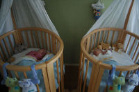 Both girls turned around in their beds