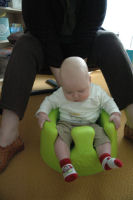 Caroline in the Bumbo (a special chair)