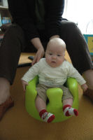 Caroline in the Bumbo (a special chair)