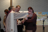 Alexandra being baptised
