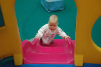 Alexandra goes up the slide