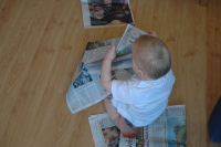 Alexandra reading the newspaper