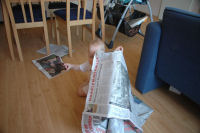 Alexandra reading the newspaper