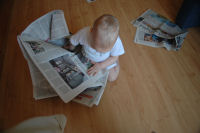 Alexandra reading the newspaper