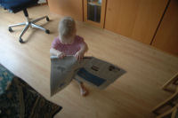 Alexandra reading the newspaper
