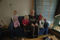 Reading a book together with granddad and Evi