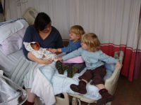 Caroline and Alexandra meeting their new sister