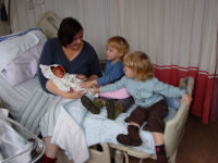 Caroline and Alexandra meeting their new sister