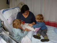 Caroline and Alexandra meeting their new sister