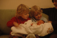 Caroline and Alexandra are holding Madeleine