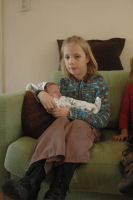 Cousin Tessa holding Madeleine