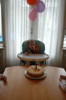 Madeleine with her cake