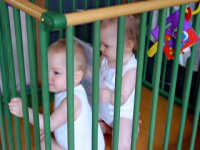 Caroline and Alexandra playing in the playpen